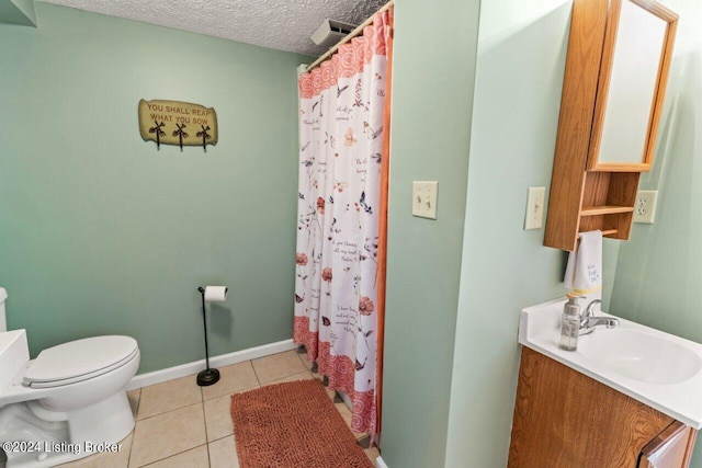 bathroom with a textured ceiling, toilet, tile patterned flooring, and curtained shower