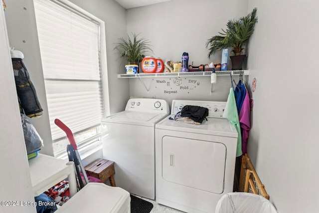 laundry room featuring washing machine and dryer