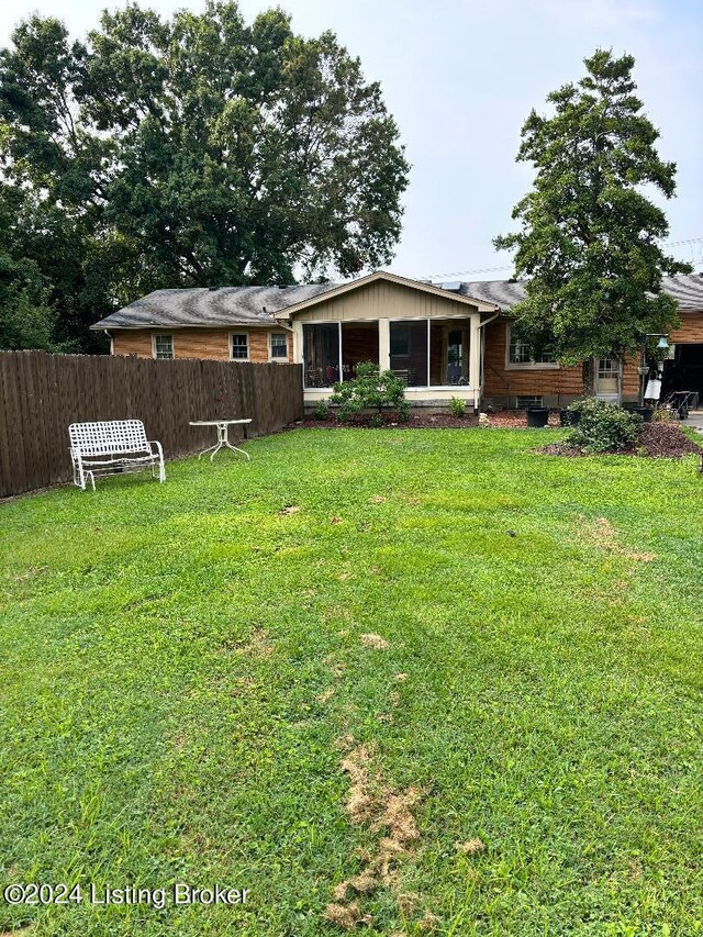 view of front of home with a front yard