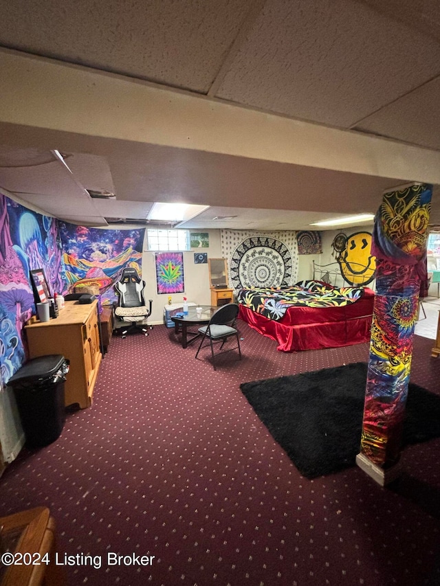 rec room featuring carpet flooring and a paneled ceiling