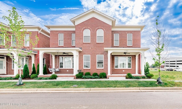 townhome / multi-family property with a front yard and ceiling fan