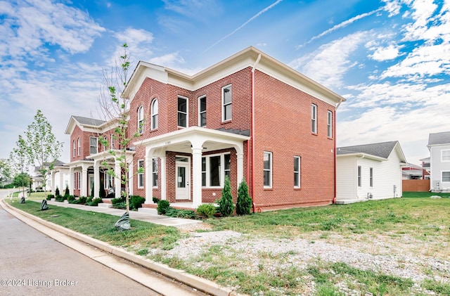 view of front of property with a front lawn