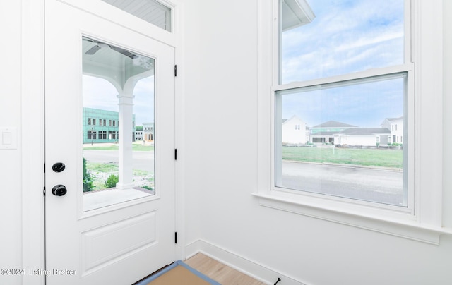 doorway to outside with hardwood / wood-style floors