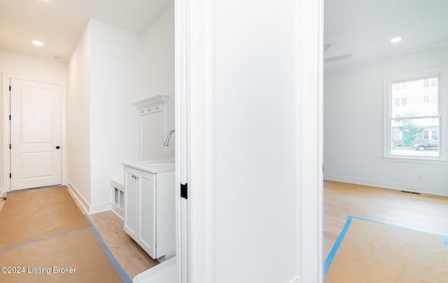 bathroom with hardwood / wood-style flooring