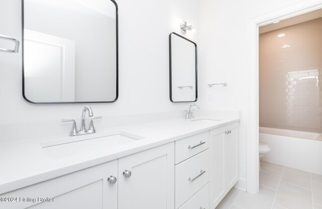 full bathroom with vanity, toilet, tile patterned flooring, and shower / bathing tub combination