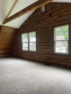 7900 Organ Creek Rd, Pendleton, KY 40055 - additional living space featuring light carpet, beam ceiling, high vaulted ceiling, and rustic walls
