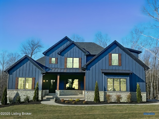 view of front of house featuring a front lawn and a porch