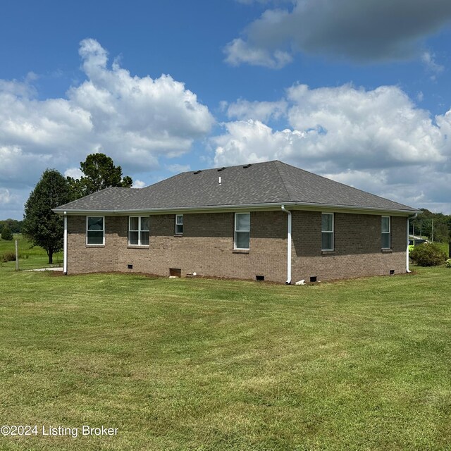 27 Jenkins Rd, Rineyville, KY 40162 - back of house featuring a lawn, a shingled roof, brick siding, and crawl space