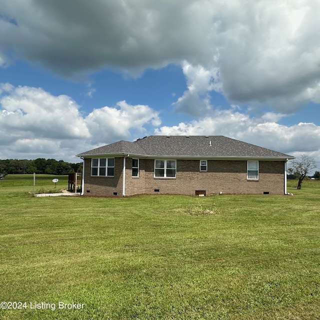 27 Jenkins Rd, Rineyville, KY 40162 - back of property featuring crawl space, a shingled roof, brick siding, and a lawn