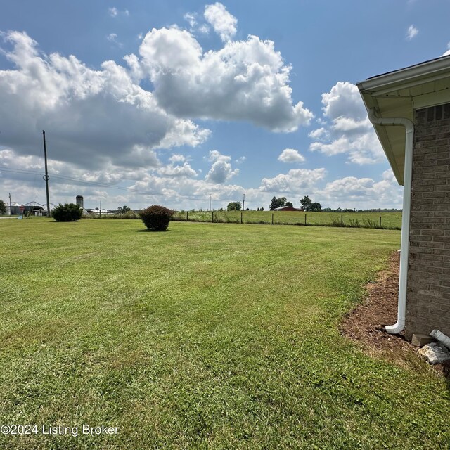 view of yard with a rural view