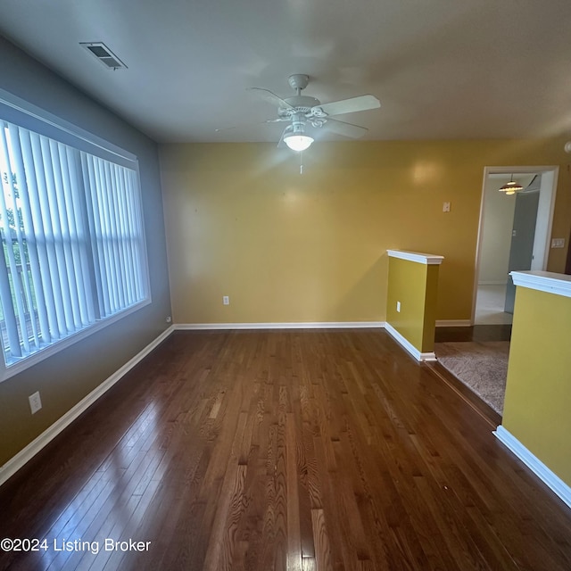 27 Jenkins Rd, Rineyville, KY 40162 - unfurnished room with a ceiling fan, dark wood-type flooring, baseboards, and visible vents