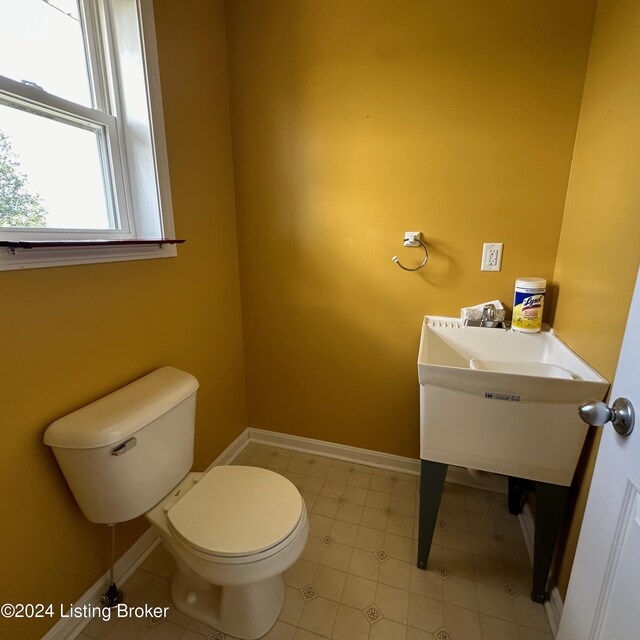 bathroom featuring toilet and tile patterned floors