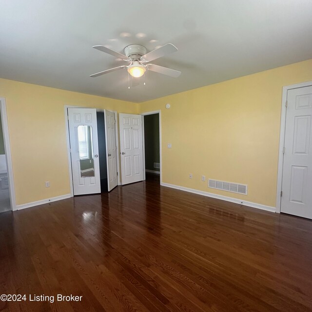 unfurnished bedroom with ceiling fan and wood-type flooring