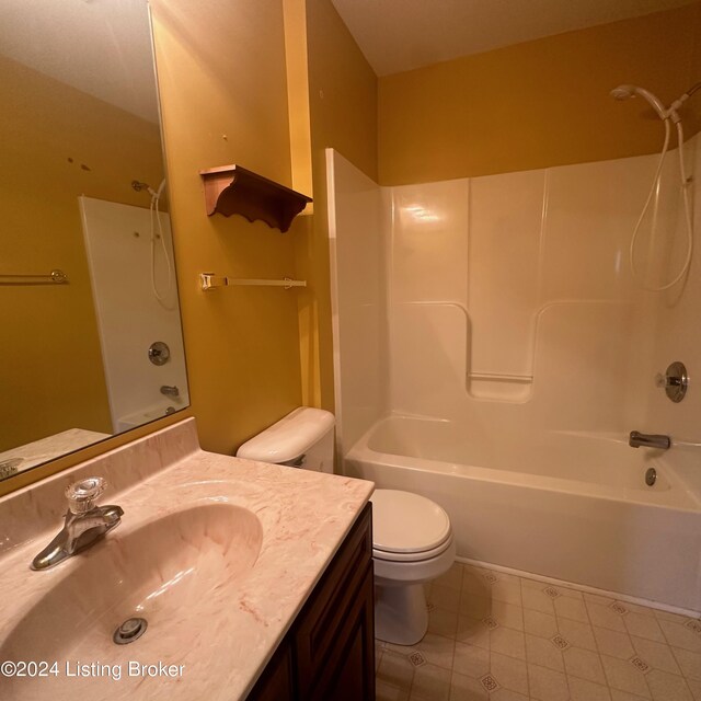 full bathroom featuring tile patterned flooring, toilet, vanity, and shower / bath combination