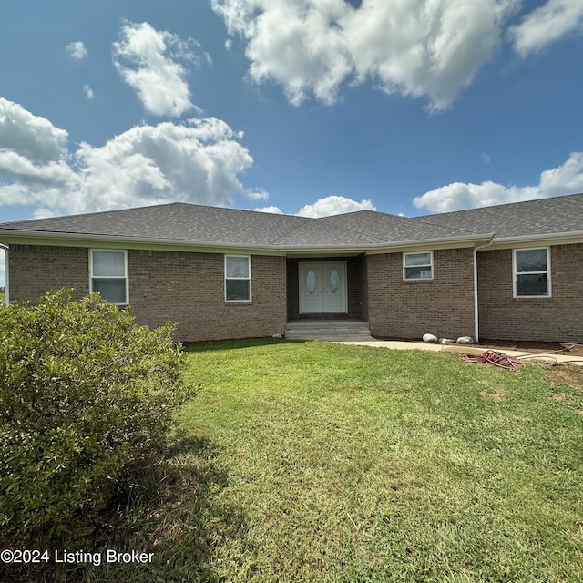 27 Jenkins Rd, Rineyville, KY 40162 - ranch-style house with brick siding, roof with shingles, french doors, and a front yard