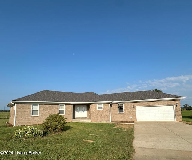 27 Jenkins Rd, Rineyville, KY 40162 - single story home featuring driveway, brick siding, a garage, and a front yard