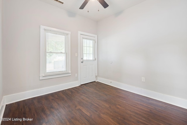 empty room featuring dark hardwood / wood-style floors and ceiling fan