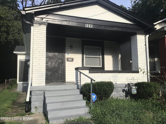 property entrance with covered porch