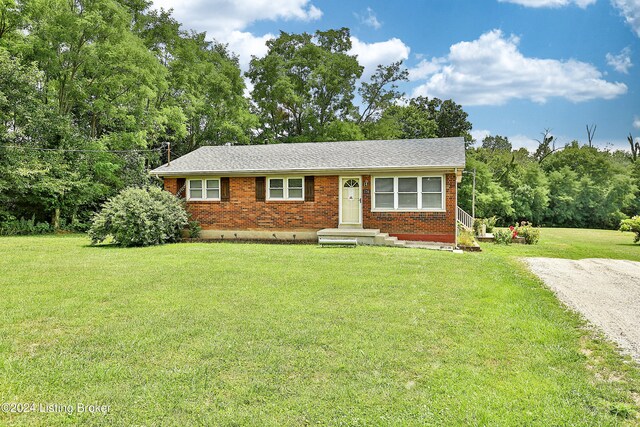 ranch-style house with a front yard