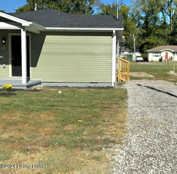 garage featuring a yard