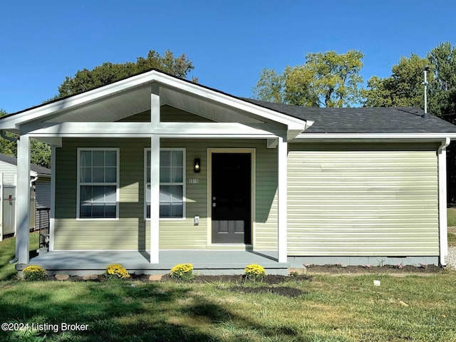 view of front of house featuring a front lawn and a porch