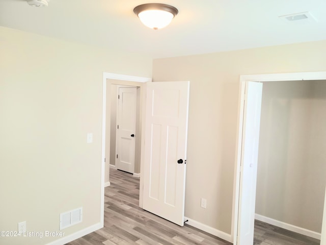 unfurnished bedroom featuring light hardwood / wood-style flooring