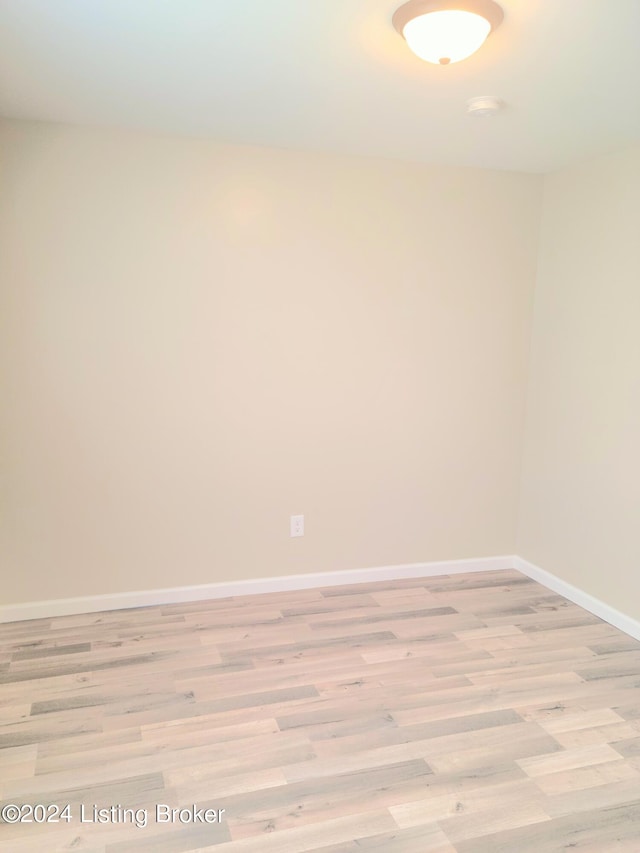 spare room featuring light hardwood / wood-style flooring