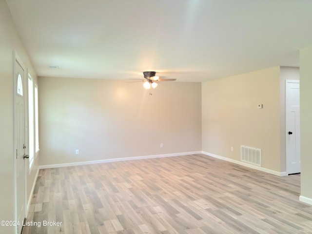 unfurnished room with ceiling fan and light hardwood / wood-style floors