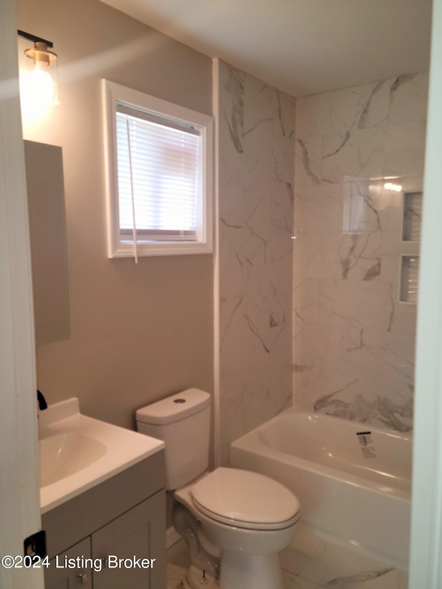 full bathroom with tiled shower / bath, toilet, and vanity