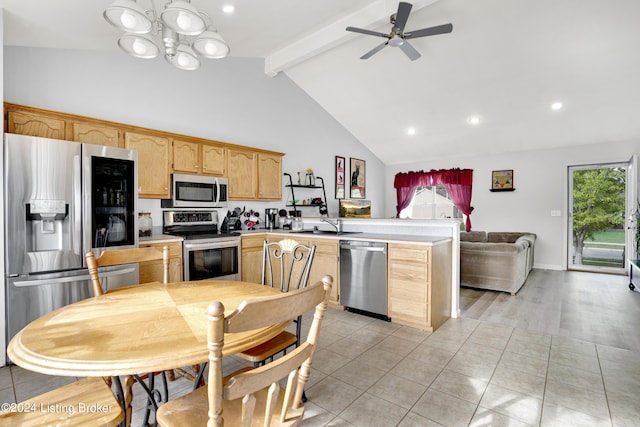 kitchen with beam ceiling, appliances with stainless steel finishes, high vaulted ceiling, light hardwood / wood-style flooring, and ceiling fan with notable chandelier