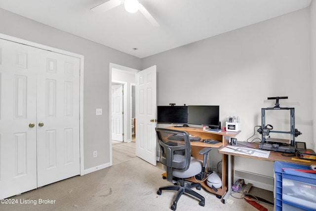 office area with ceiling fan and light colored carpet