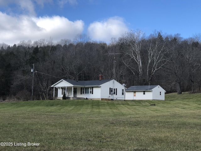 view of front of house with a porch and a front lawn