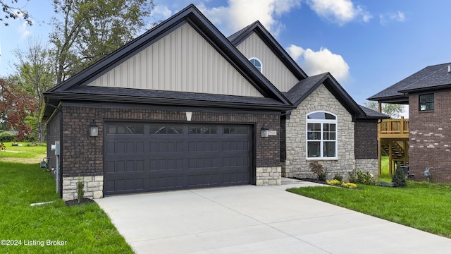 view of front of home featuring a garage and a front lawn