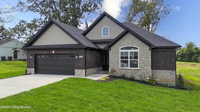 view of front of property with a garage and a front lawn