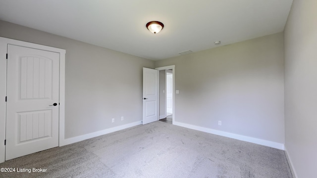 unfurnished bedroom featuring light colored carpet