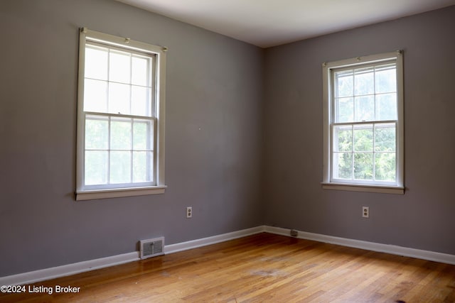 spare room with light hardwood / wood-style flooring