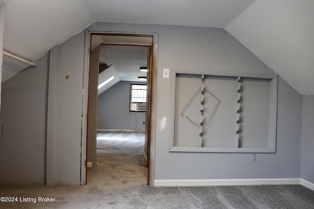 bonus room with vaulted ceiling and light carpet