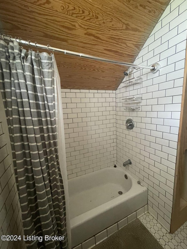 bathroom featuring shower / bathtub combination with curtain, wooden ceiling, vaulted ceiling, and tile walls