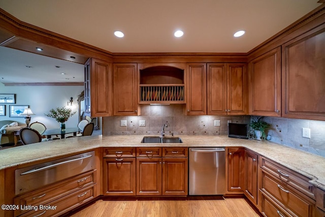 kitchen with a sink, stainless steel dishwasher, a warming drawer, light wood finished floors, and brown cabinetry