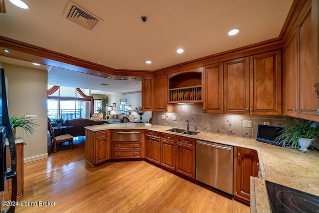 kitchen with visible vents, brown cabinetry, stainless steel dishwasher, light wood-style floors, and a sink