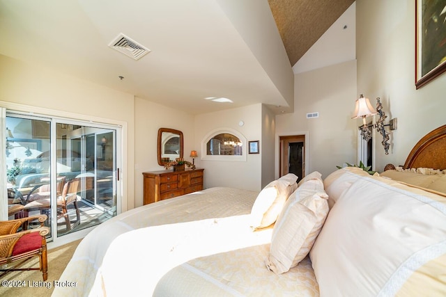 bedroom featuring light carpet, access to outside, and visible vents