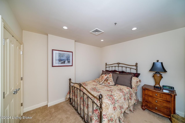 bedroom with light carpet, baseboards, visible vents, and recessed lighting