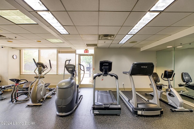 workout area with a drop ceiling and visible vents