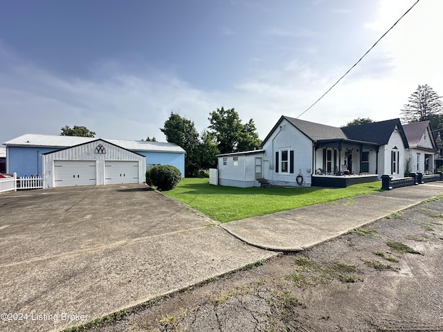 view of side of home featuring a porch and a yard