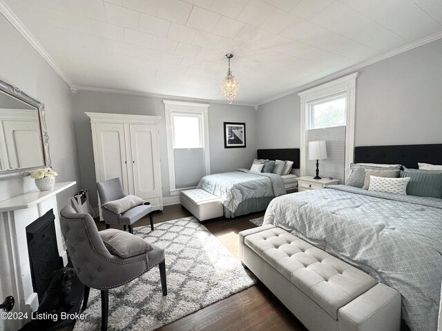 bedroom featuring crown molding and dark hardwood / wood-style flooring