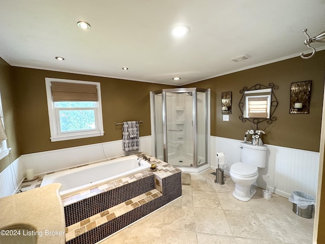 bathroom featuring plus walk in shower, tile patterned floors, crown molding, and toilet