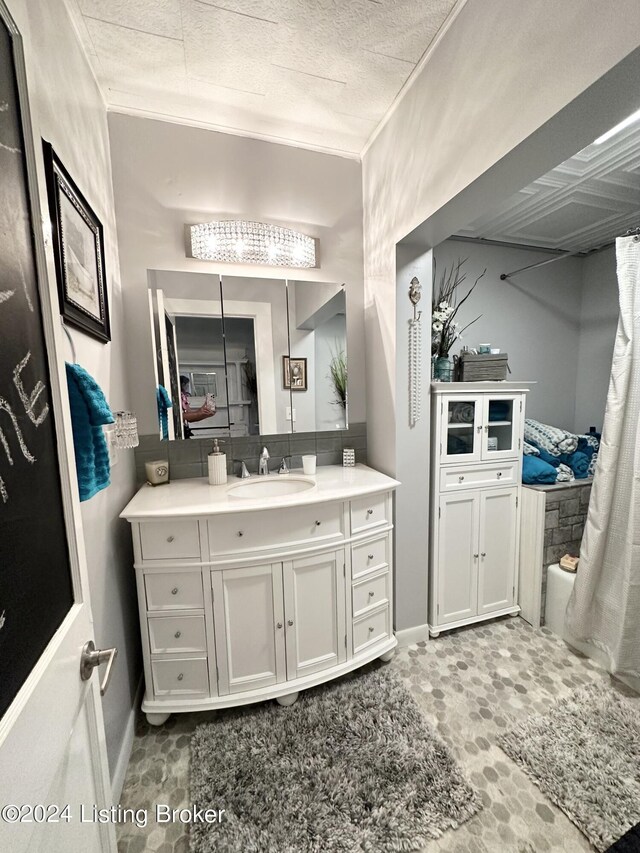 bathroom featuring vanity and crown molding