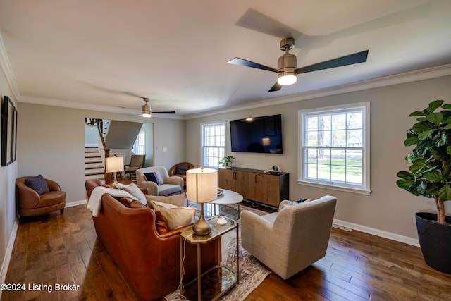 living room featuring crown molding, dark hardwood / wood-style flooring, and ceiling fan