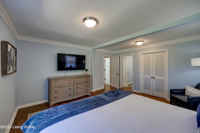 bedroom with a closet, wood-type flooring, and ornamental molding