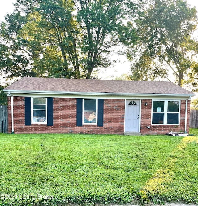 single story home with a front yard